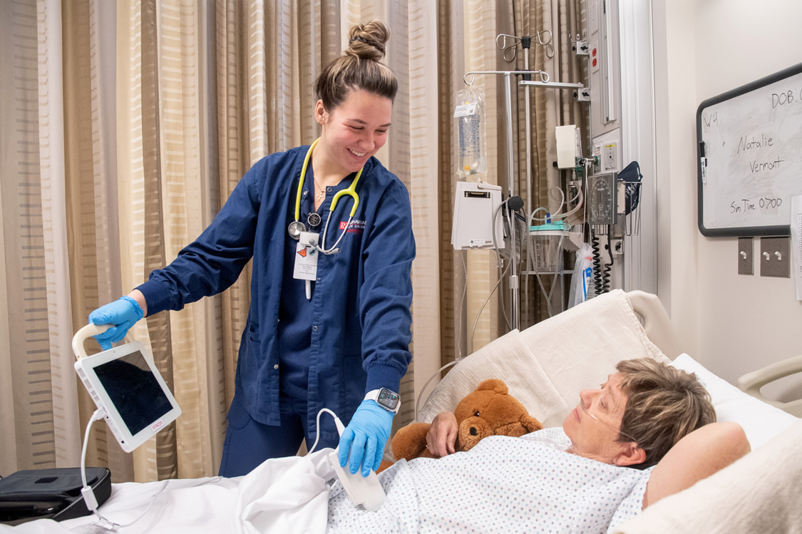 Nursing student with patient